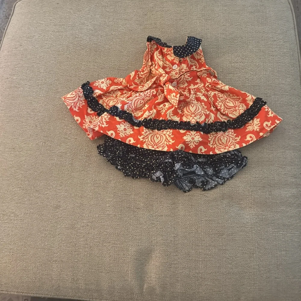 Blue and orange pernickety top and bottom set.